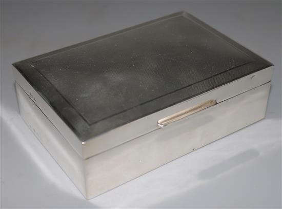 A 1950s engine turned silver cigarette box, 5in.